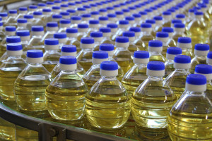 Sunflower oil in the bottle moving on production line